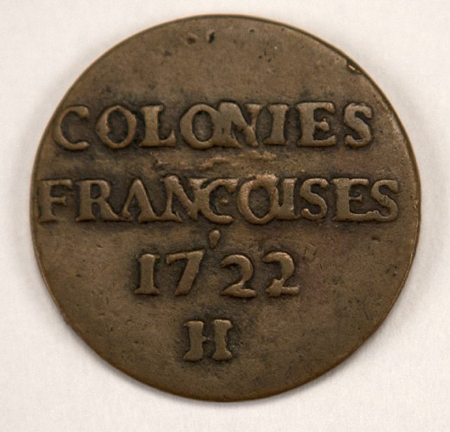 Copper sou or nine denier piece minted for the French colonies. The copper blanks were imported from Sweden. This coin was minted in La Rochelle, although there were others minted in Rouen. These coins were minted in 1721 and 1722. The coins were not successful, since the colonists disliked copper coins, and in 1726 most of the issue was returned to France.