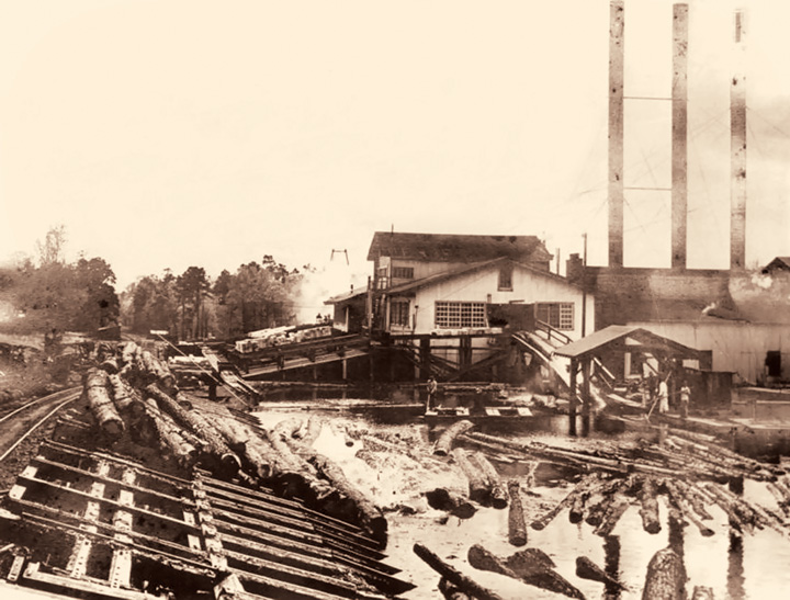The Crowell and Spencer sawmill at Long Leaf as it appeared in the 1930s with a log pond and dump track in the foreground. Courtesy of Southern Forest Heritage Museum, Crowell Family Collection.