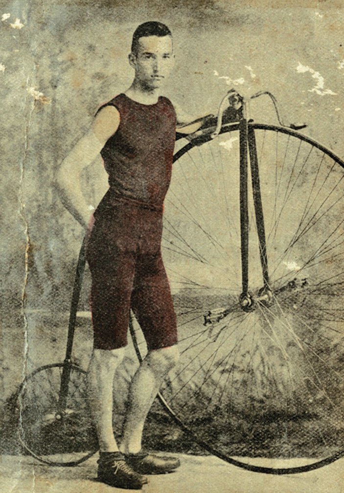 A cyclist poses with a penny-farthing, also known as a highwheel. Courtesy of the Historic New Orleans Collection. 