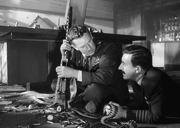 In this scene from Dr. Strangelove or: How I Learned to Stop Worrying and Love the Bomb, Ripper tells Mandrake that he discovered the Communist plot to pollute Americans' "precious bodily fluids" during "the physical act of love." Courtesy of Columbia Pictures