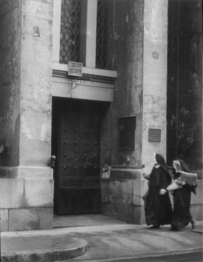 “Nuns walking in front of the Arsenal”