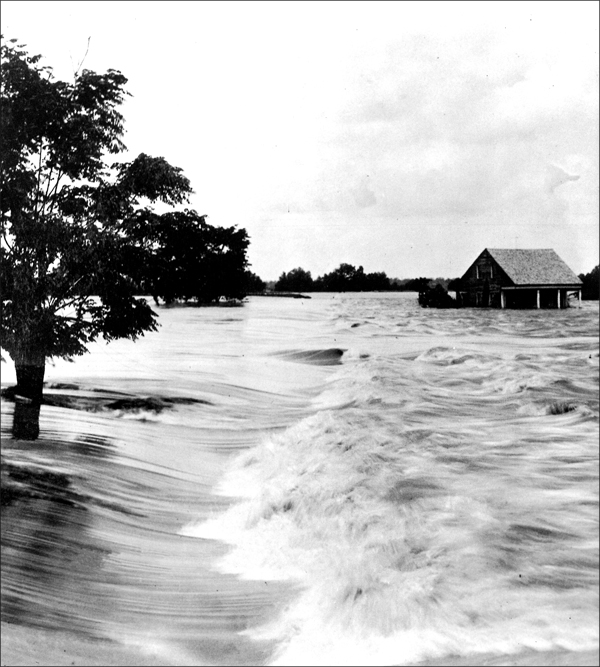 An Acadian-style house inundated by flood waters during 1927 flood