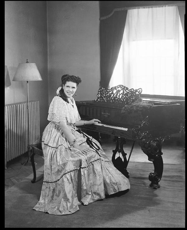 Camille Nickerson seated at piano