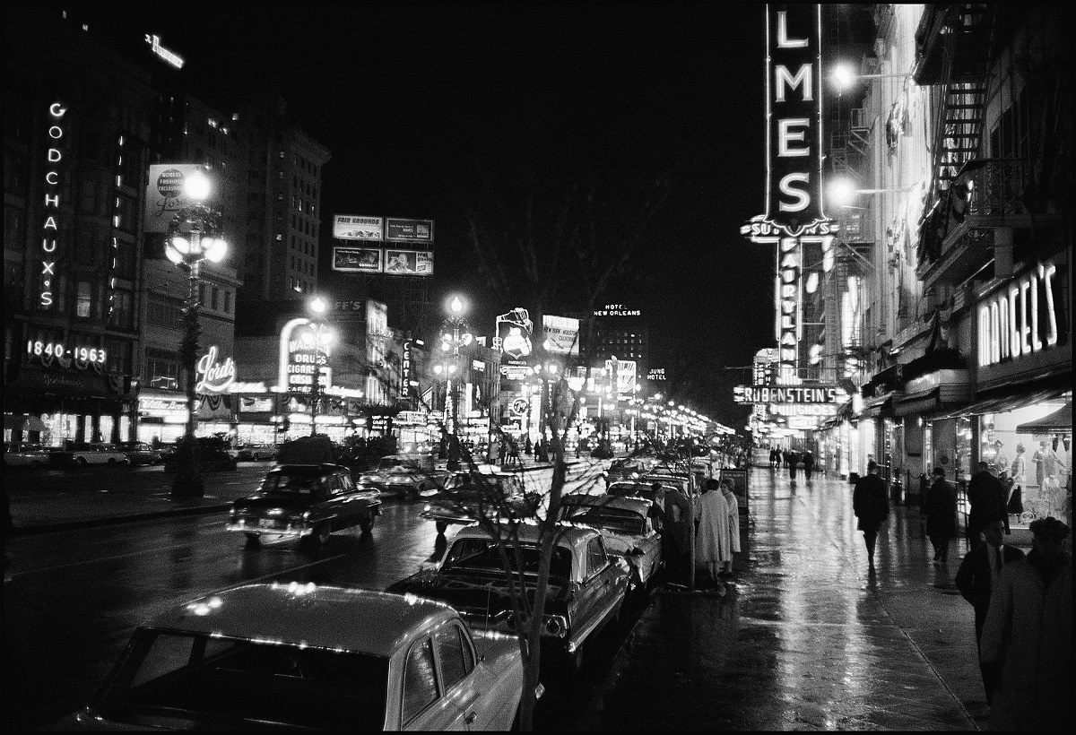 black and white image of a street at night