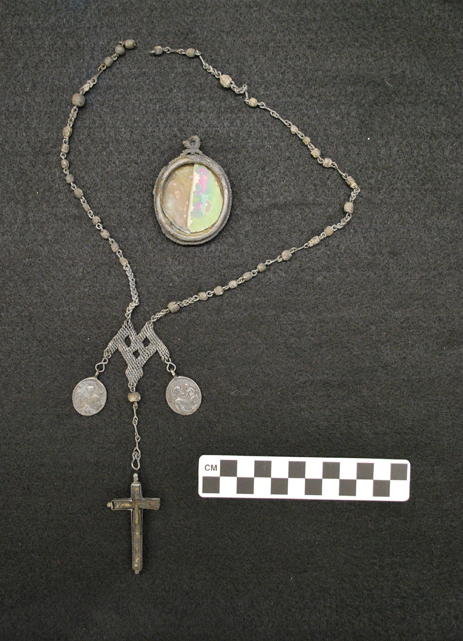 Medallion and Crucifix Recovered from St. Peter Street Cemetery