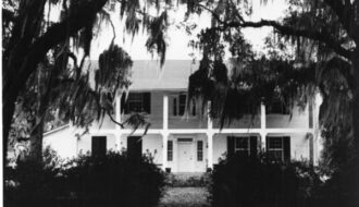 A black and white photograph from the 1970s of the Highland Plantation home in St. Francisville. Courtesy of the State Library of Louisiana.